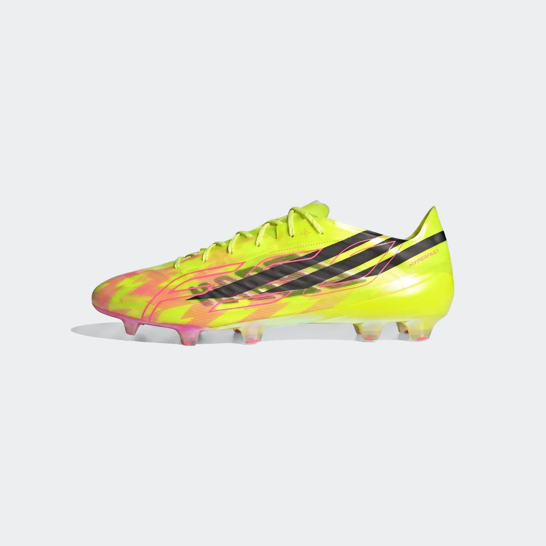 A side view of the F50 Hyperfast Evo Firm Ground Football Boot in neon yellow with pink and black graphic designs.