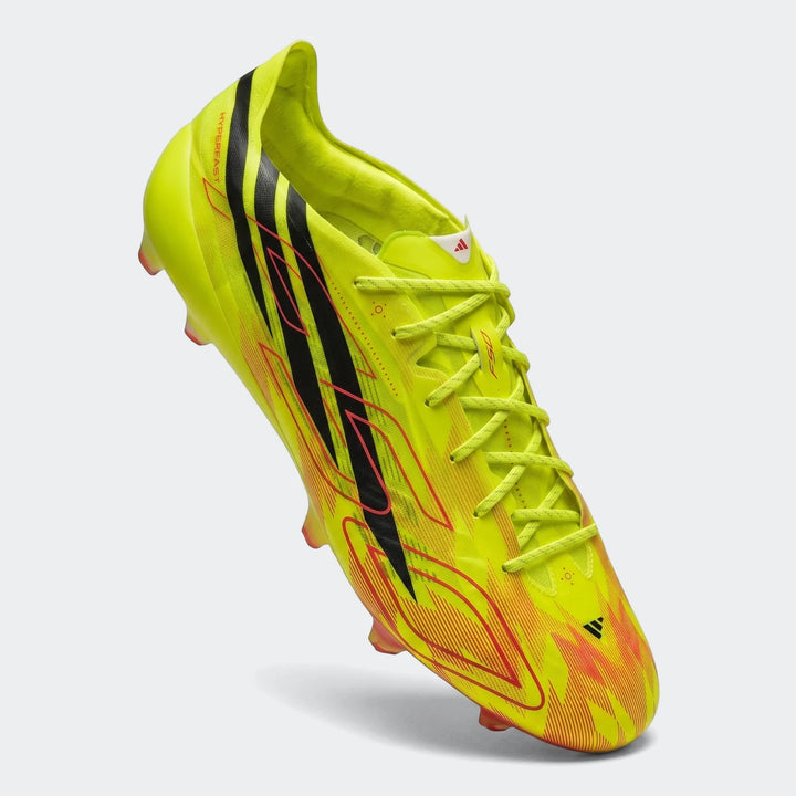 Lime green F50 Hyperfast Evo Firm Ground Football Boots with black stripes and red graphics, shown from a side-elevated view.