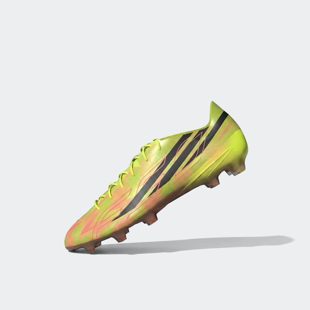 Lime green and orange Adidas F50 Hyperfast Evo Firm Ground Football Boots with black stripes, shown angled upwards.