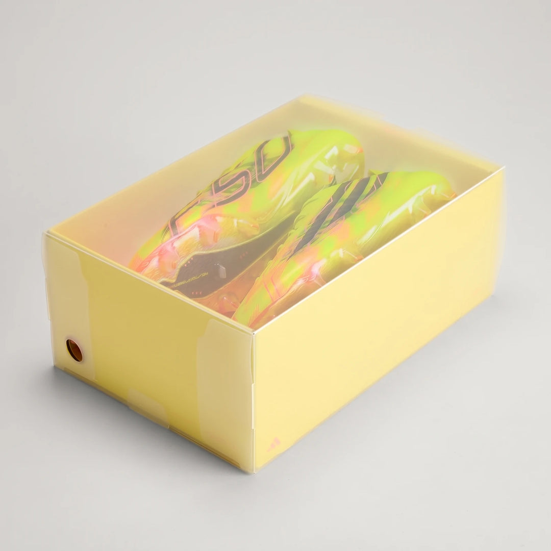 Vibrant yellow and green F50 Hyperfast Evo Firm Ground Football Boots, presented inside a clear yellow display box. Angled