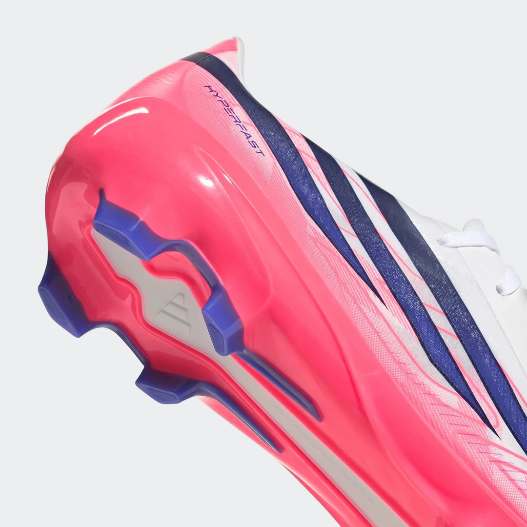 Close-up, bottom-side view of a pink, white, and blue Adidas F50 Hyperfast League Firm Ground Football Boot, showing the