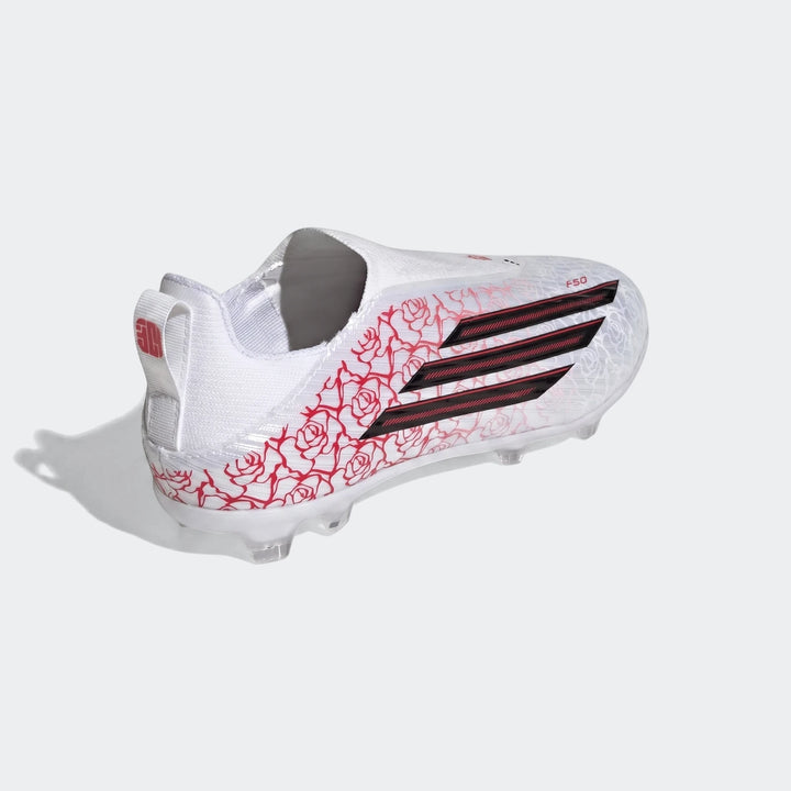 White Adidas F50 League Ll Fg / Mg Lamine Yamal kids football boots with red rose pattern and black stripes, side view.