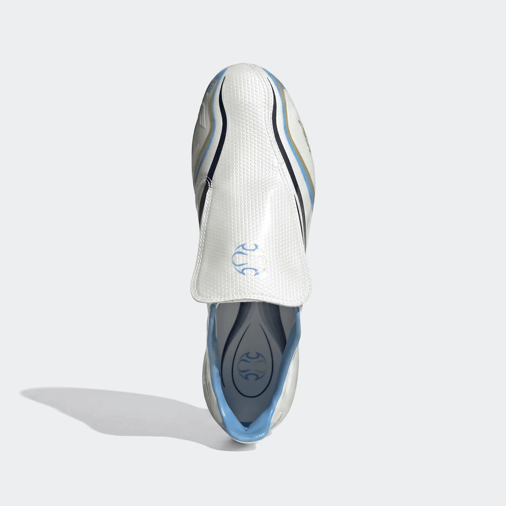 White and blue F50 Tunit Firm Ground Football Boots, shown from a top-down view, showcasing intricate details and branding.