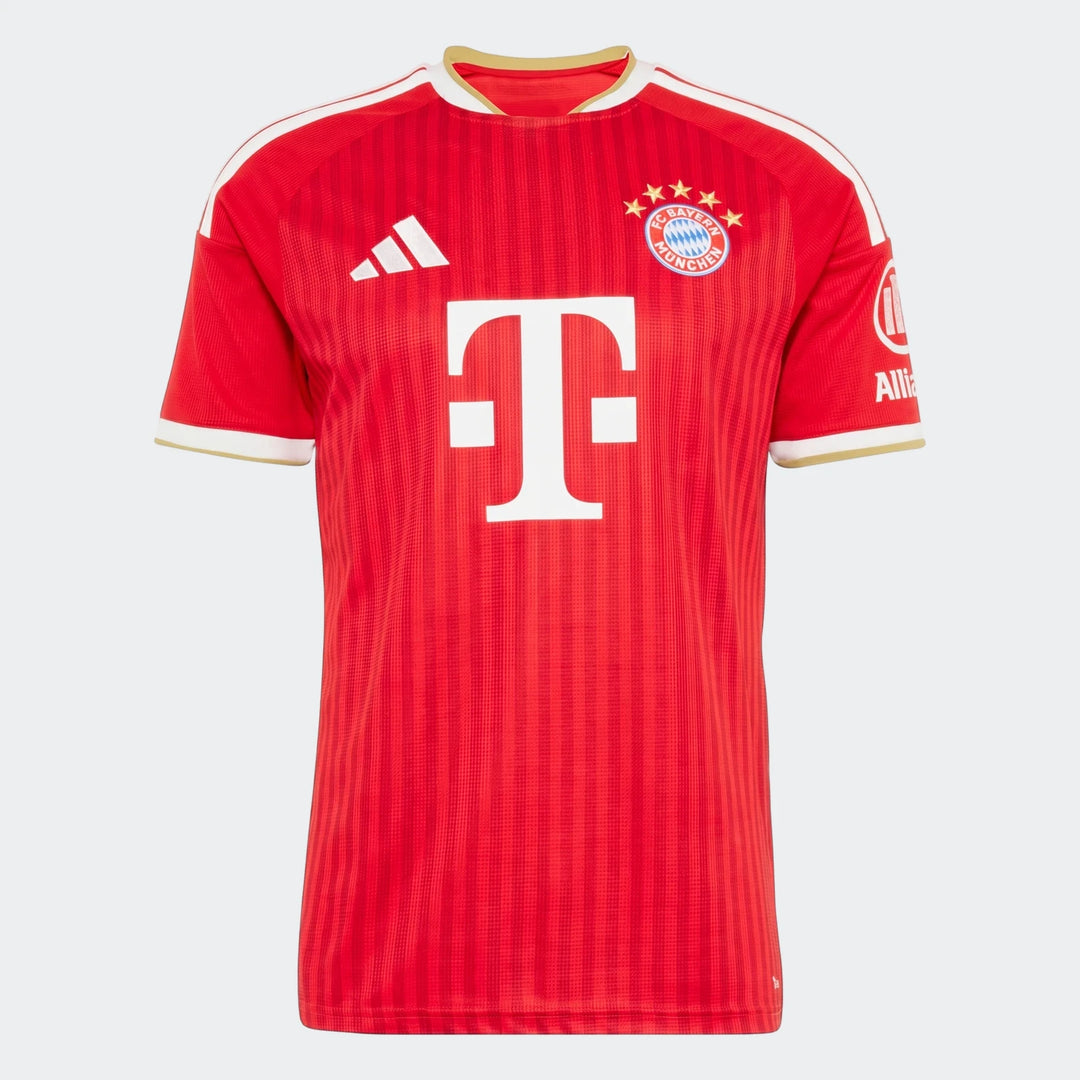 FC Bayern 26/27 Home Jersey in red with white shoulder stripes, gold trim, and sponsor logos, front view on a white