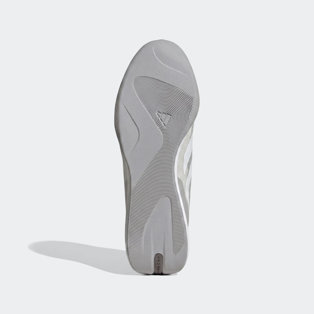 Bottom view of a gray Feroza Base shoe sole, featuring a textured tread pattern and the prominent Adidas logo. Ideal for