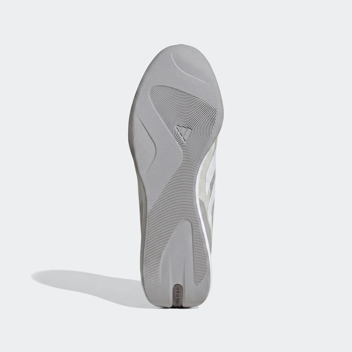 Bottom view of a gray Feroza Base shoe sole, featuring a textured tread pattern and the prominent Adidas logo. Ideal for