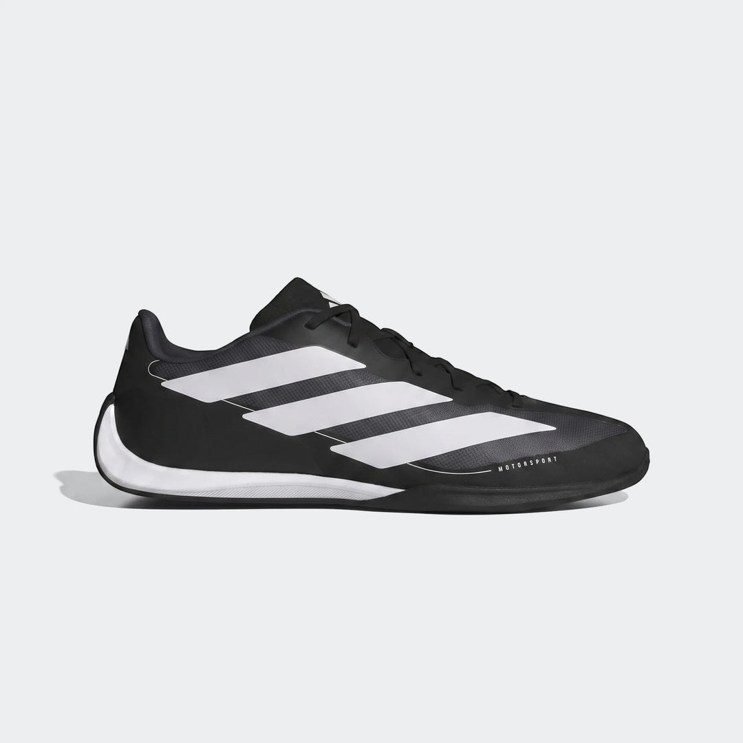Black and white Adidas Feroza Base Shoes, shown in a side view, featuring three white stripes and "MOTORSPORT" branding.