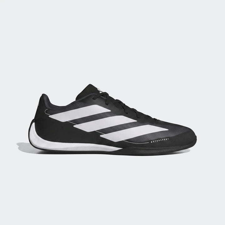 Black and white Adidas Feroza Base Shoes, shown in a side view, featuring three white stripes and "MOTORSPORT" branding.
