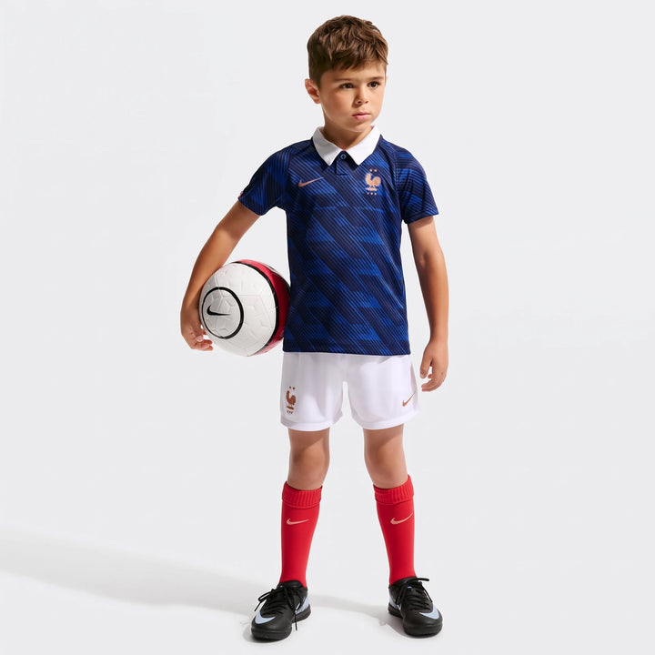 Fff 2026 Stadium Home Little Kids' Nike Soccer Replica 3-Piece Kit on a young boy holding a soccer ball.