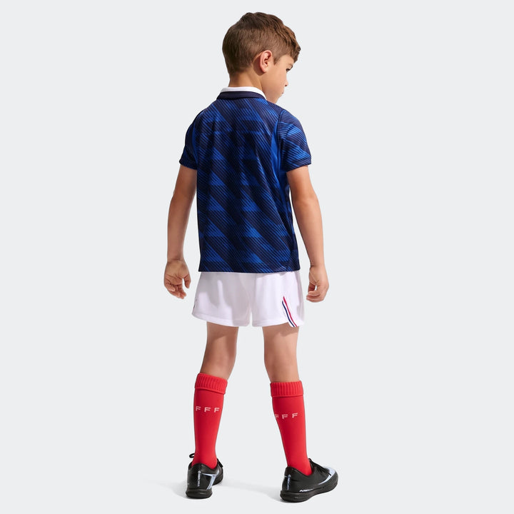 Young boy wearing the Fff 2026 Stadium Home Little Kids' Nike Soccer Replica 3-Piece Kit, viewed from the back. The kit