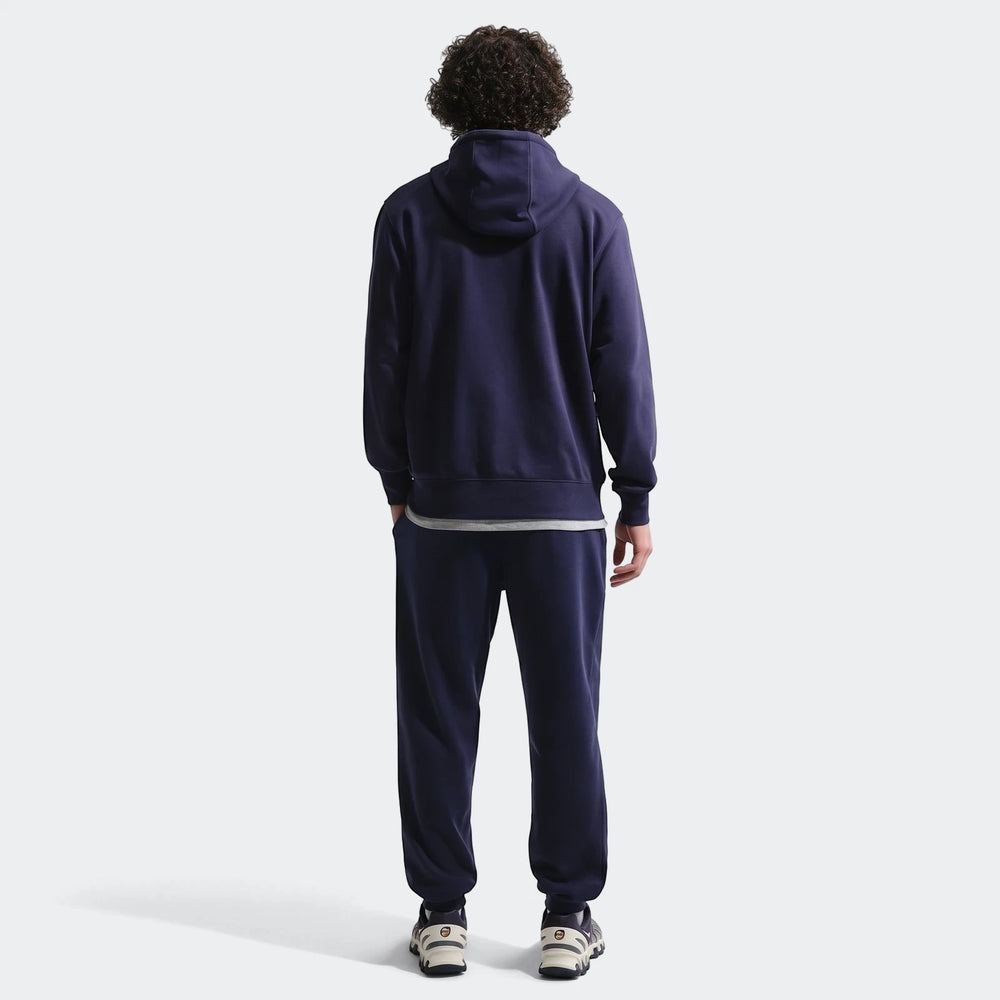 Navy blue Fff Club Men's Nike Soccer French Terry Joggers and matching hoodie worn by a model, back view.