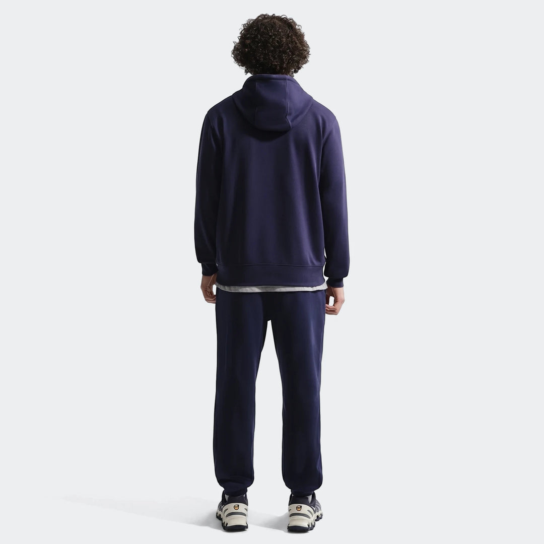 Fff Club Blue Men's Nike Soccer French Terry Pullover Hoodie and sweatpants, worn by a man from the back.