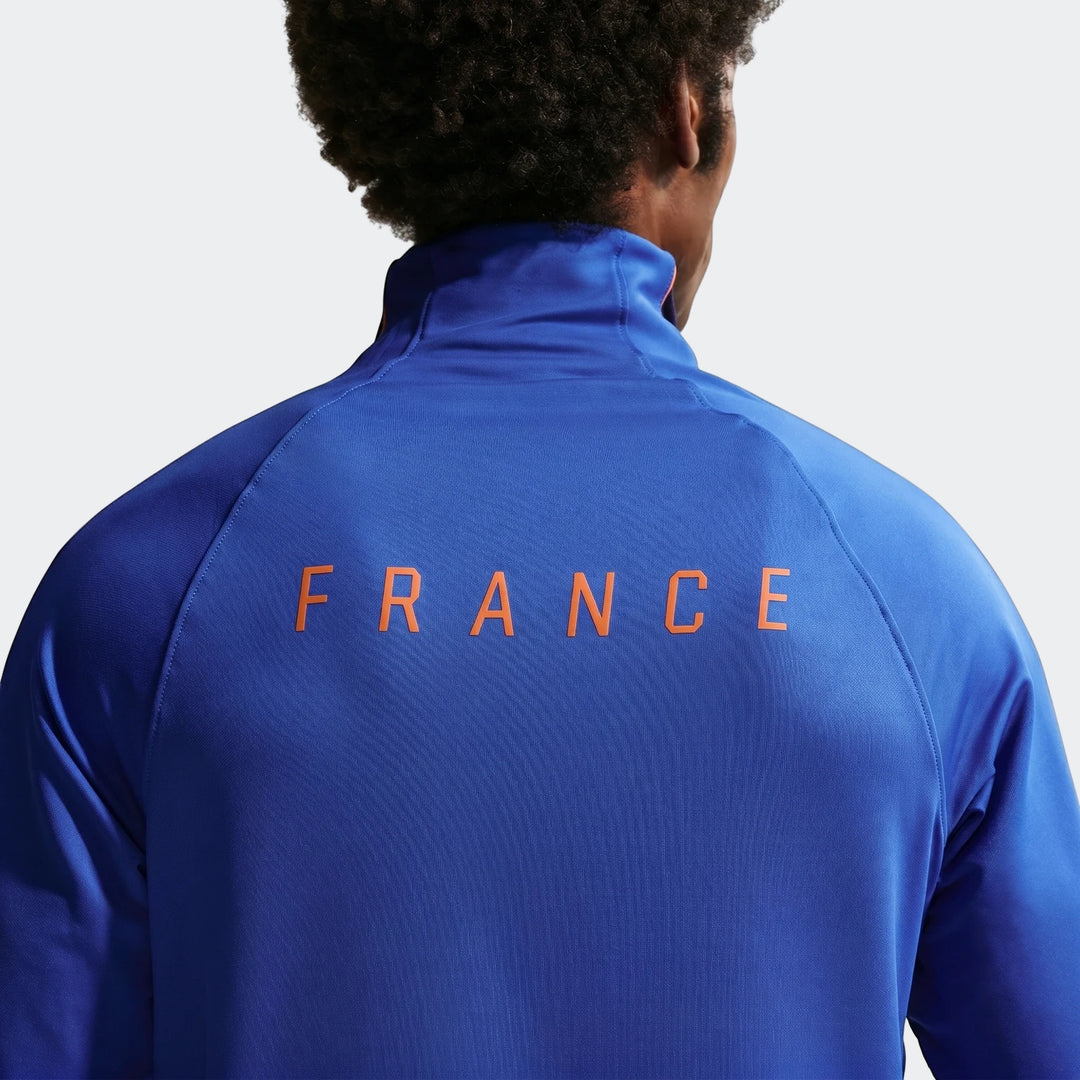 Back view of a Fff Strike Blue Men's Nike Dri-Fit Soccer Drill Top with 'FRANCE' text on the back.