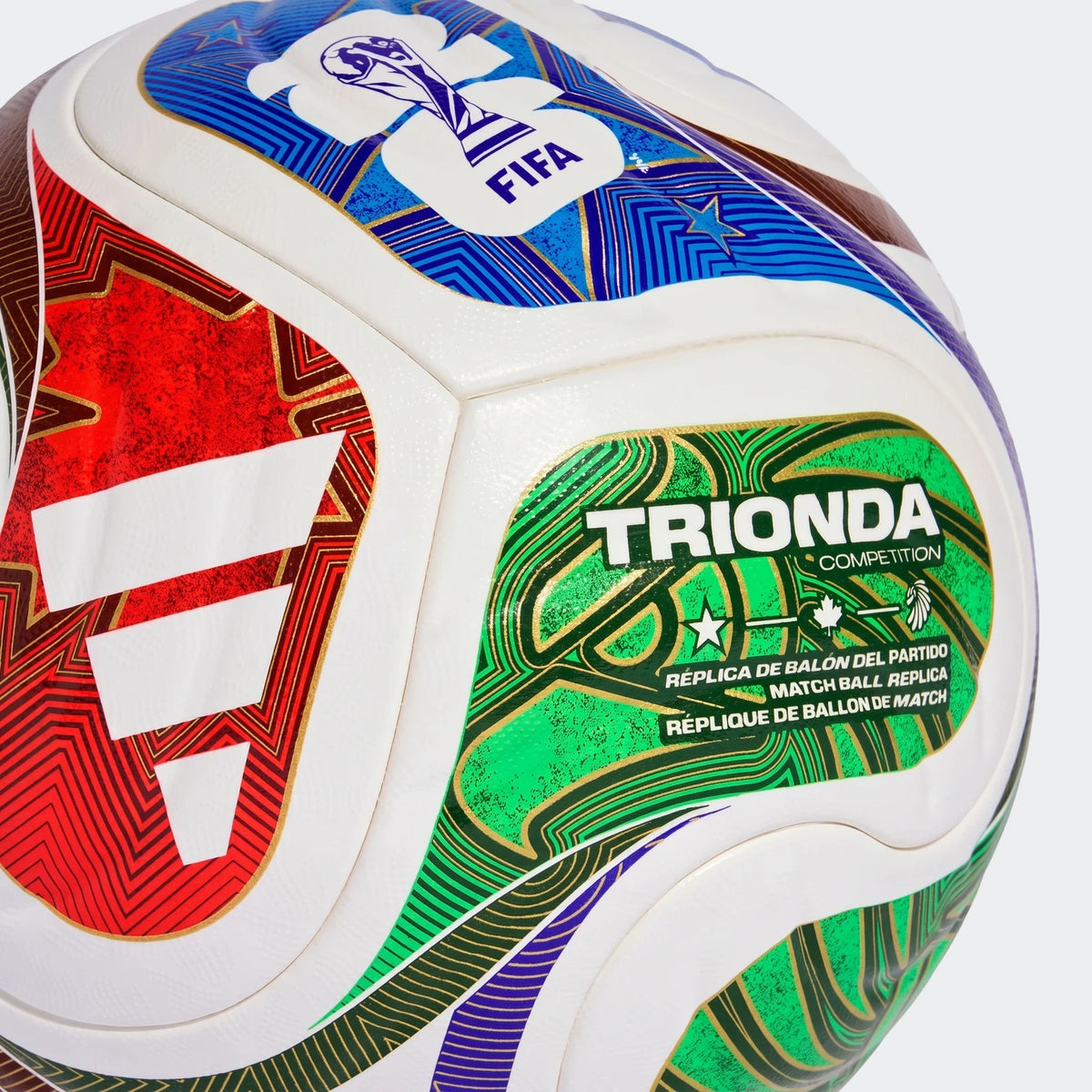 Fifa World Cup 26 Trionda Competition football, white with colorful blue, red, and green geometric panels, close-up view.