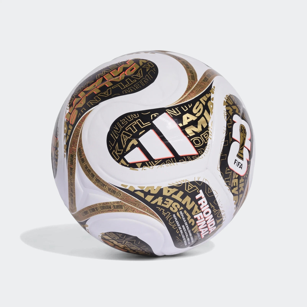 Fifa World Cup 26 Trionda Finals League soccer ball in white, black, and gold, showcasing its unique pattern from a side