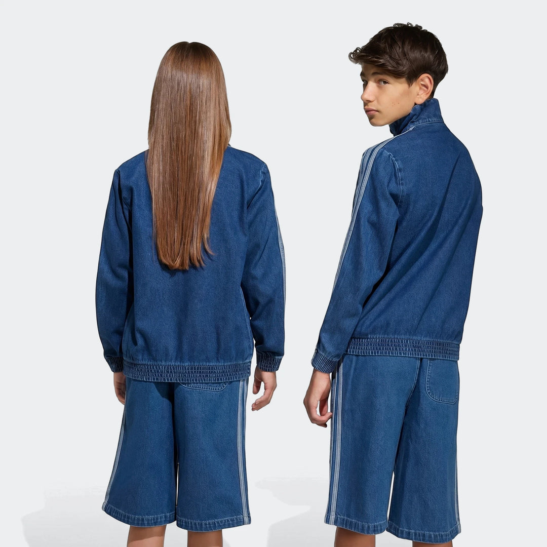 Two models wearing blue denim Firebird Track Top and matching shorts from the back and side, showing the full outfit.