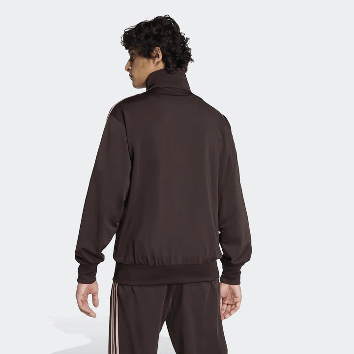 Dark brown Firebird Track Top and matching pants on a male model from the back view, showing stripes on sleeves and pants.