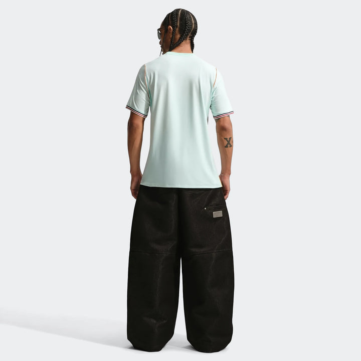 France National Team 2026 Stadium Away Green Men's Nike Dri-Fit Soccer Jersey worn by a model, back view, paired with baggy