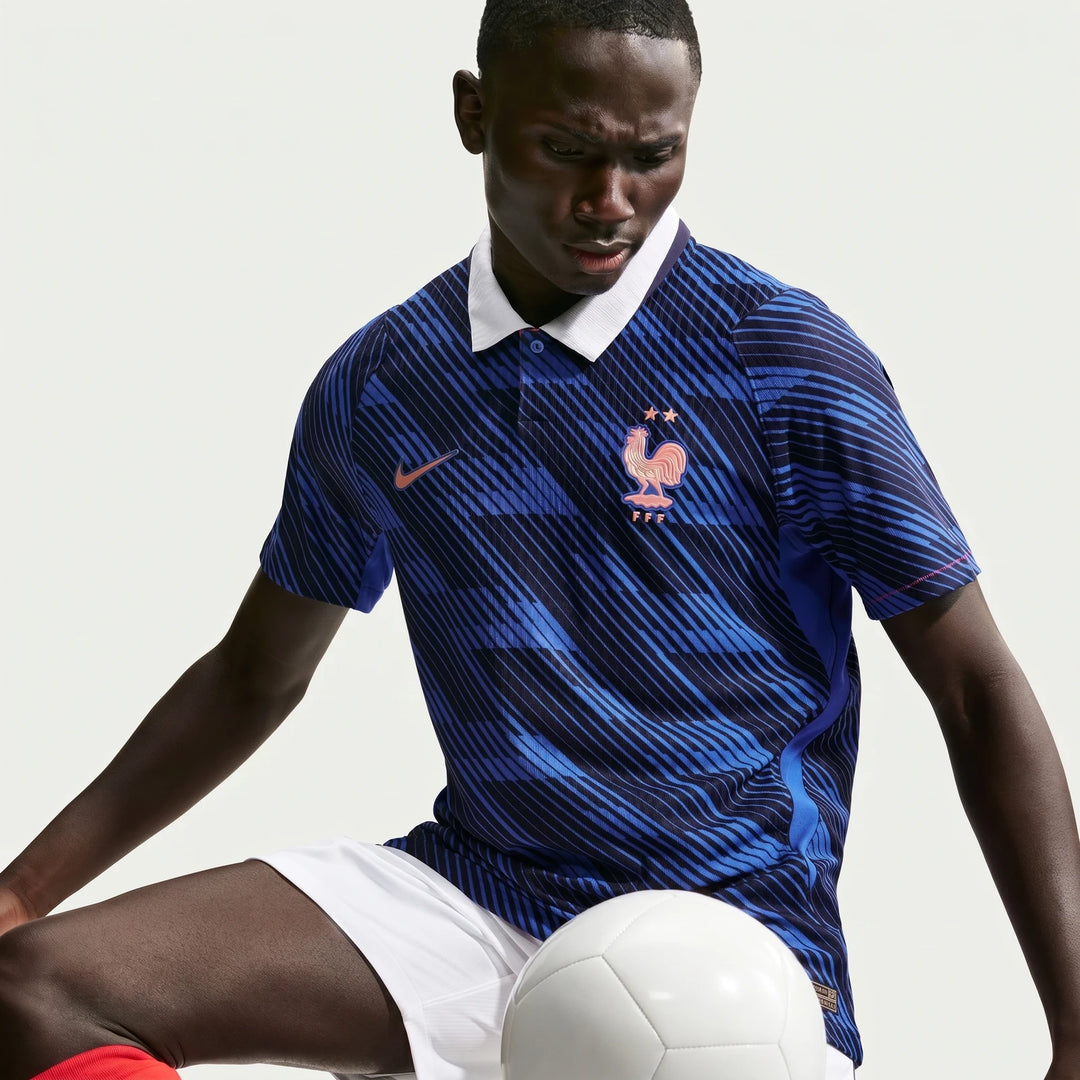 France National Team 2026 Match Home Blue Men's Nike Aero-Fit Soccer Jersey on model, with rooster crest, Nike swoosh, and