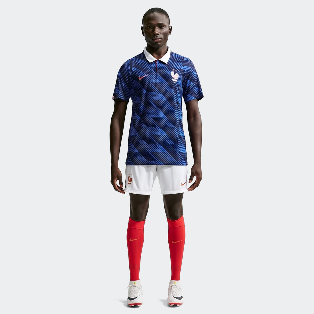Full body shot of a male model wearing the France National Team 2026 Match Home Blue Men's Nike Aero-Fit Soccer Jersey,