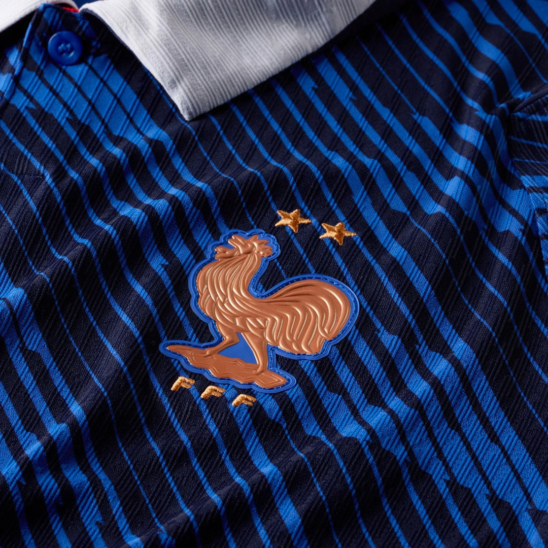 Close-up of France National Team 2026 Match Home Blue Nike Aero-Fit Soccer Jersey, showing striped fabric and embroidered