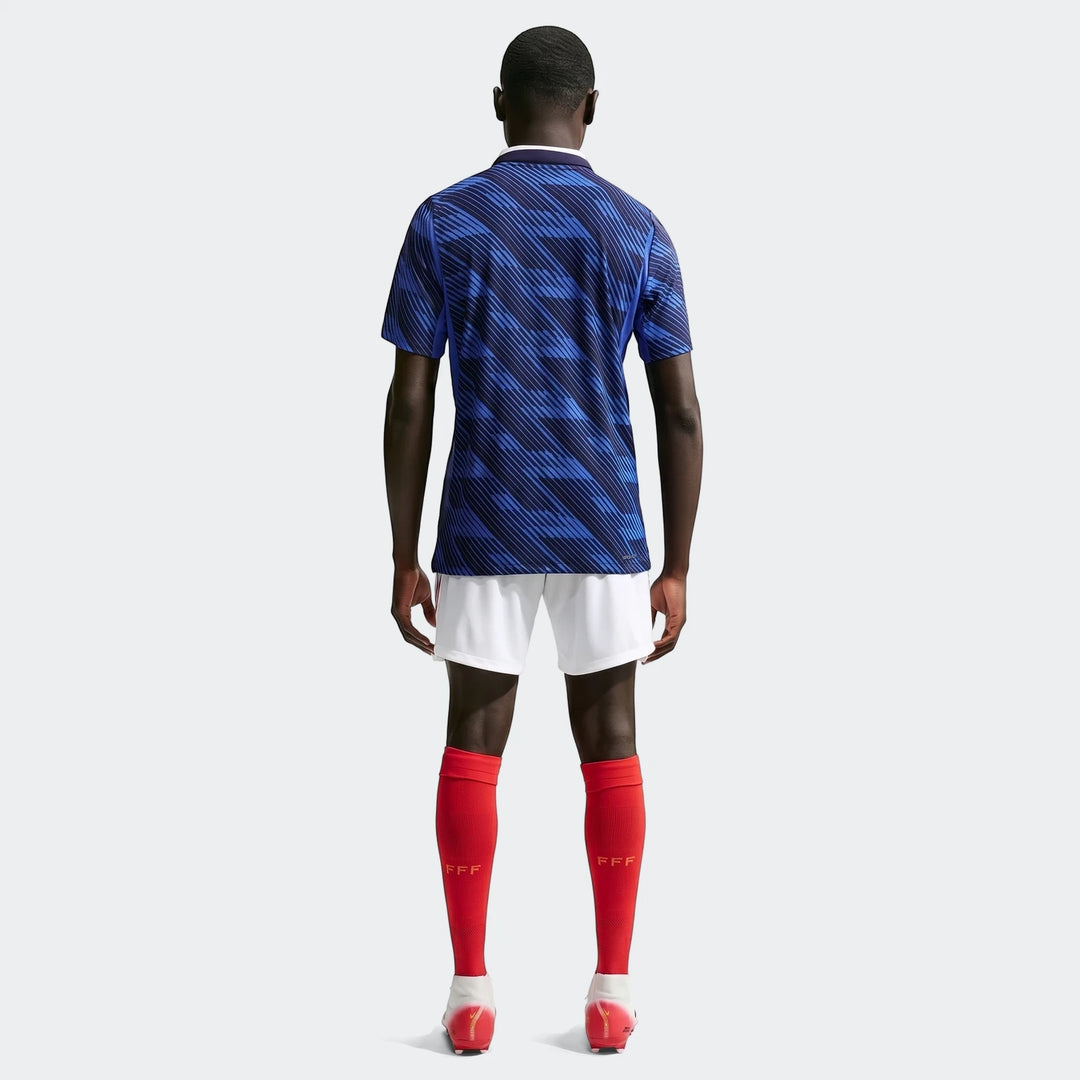 Back view of a male model wearing the France National Team 2026 Match Home Blue Men's Nike Aero-Fit Soccer Jersey with white