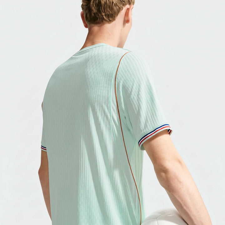 Men's France National Team 2026 Nike Aero-Fit soccer jersey in green, featuring ribbed texture, seen from the back.