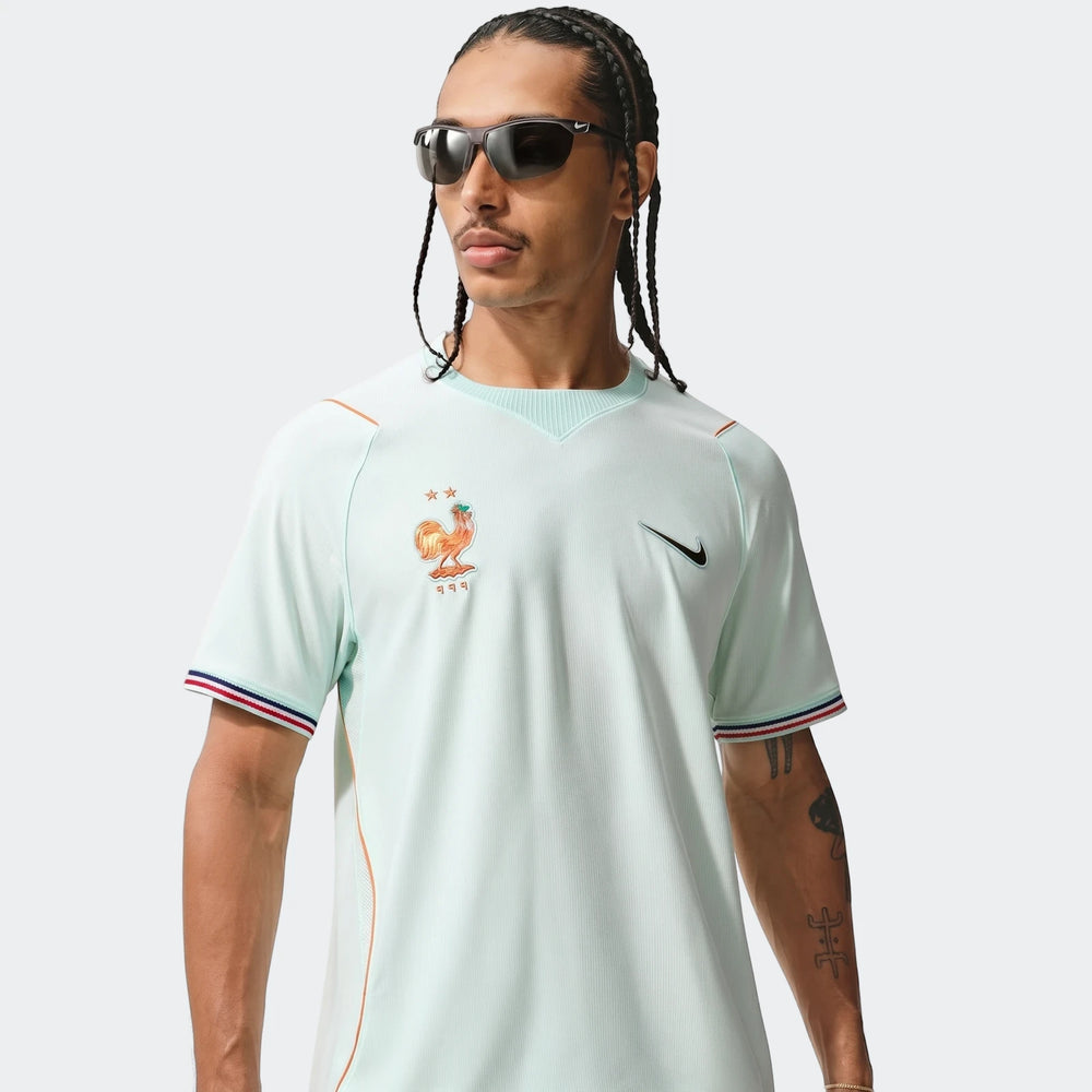 France National Team 2026 Stadium Away Green Men's Nike Dri-Fit Soccer Jersey with rooster logo, modeled from the chest up.