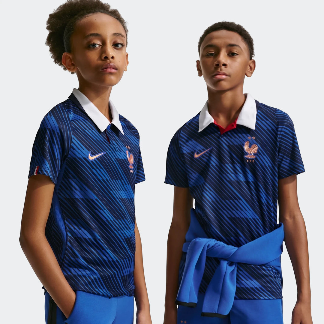 France National Team 2026 Stadium Home Blue Big Kids' Nike Dri-Fit Soccer Jersey modeled by two boys.