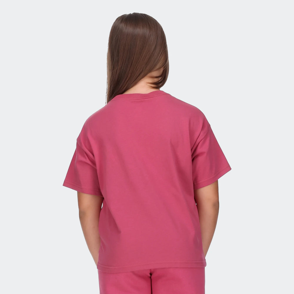 Back view of a young girl wearing a deep pink G Nsw Tee Empower Shine Red T-Shirt and matching shorts.