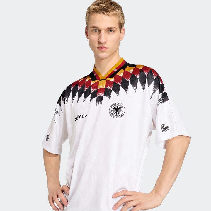 Men's white Adidas Germany 1994 Retro Home Jersey with black, red, and yellow patterns, front view.