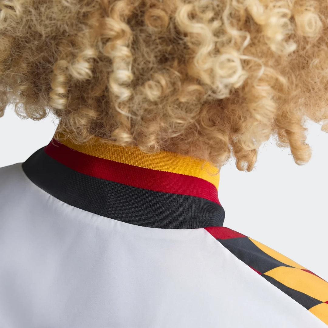 Close-up back view of the Germany 1994 Retro Track Top, showcasing its distinctive yellow, red, and black striped collar and
