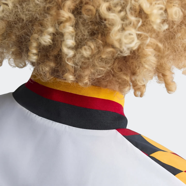 Close-up back view of the Germany 1994 Retro Track Top, showcasing its distinctive yellow, red, and black striped collar and