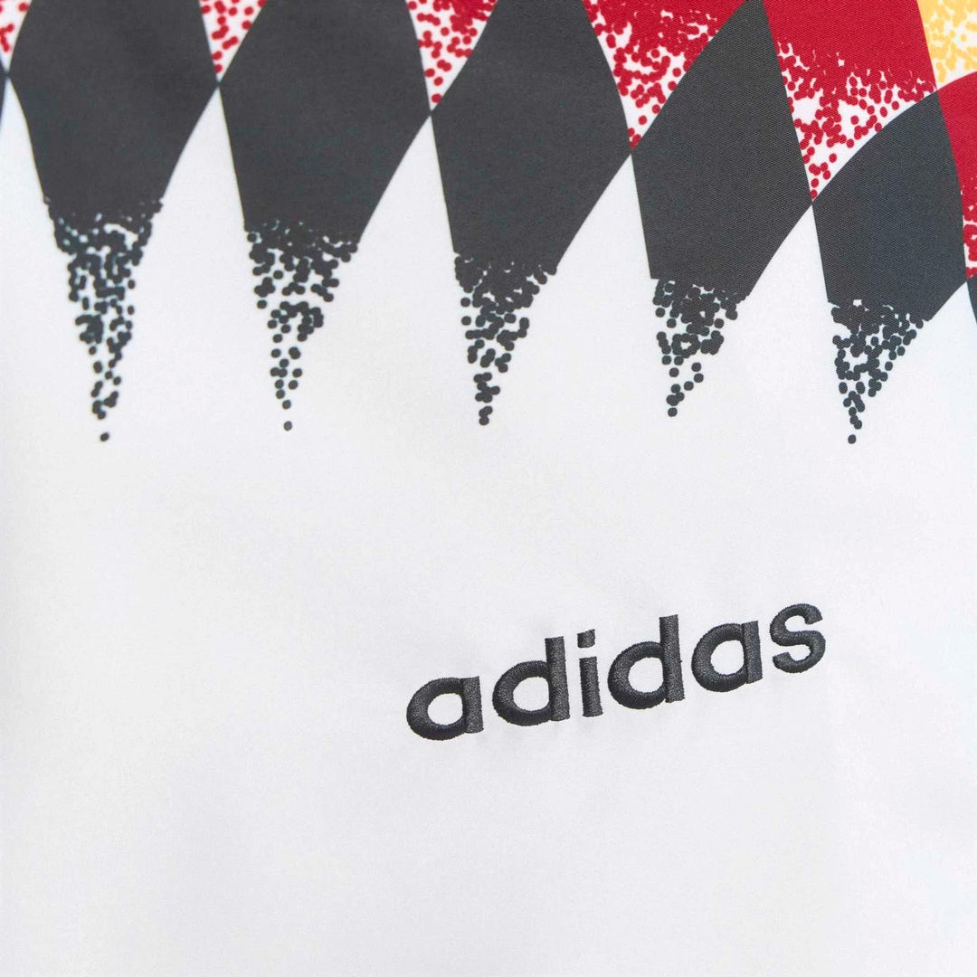Germany 1994 Retro Track Top, close-up view showcasing the diamond pattern and embroidered Adidas logo on white fabric.