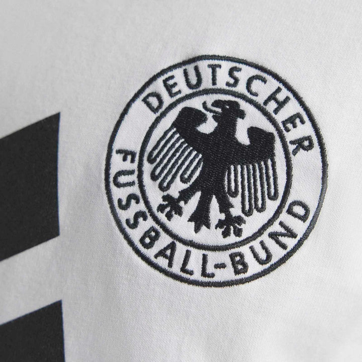Close-up of the Germany 1994 T-Shirt, showcasing the embroidered black 'DEUTSCHER FUSSBALL-BUND' eagle logo on white fabric
