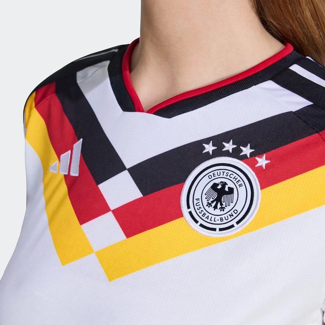 Close-up of the Germany 25/26 Home Jersey for women, featuring the DFB crest and black, red, yellow stripes.