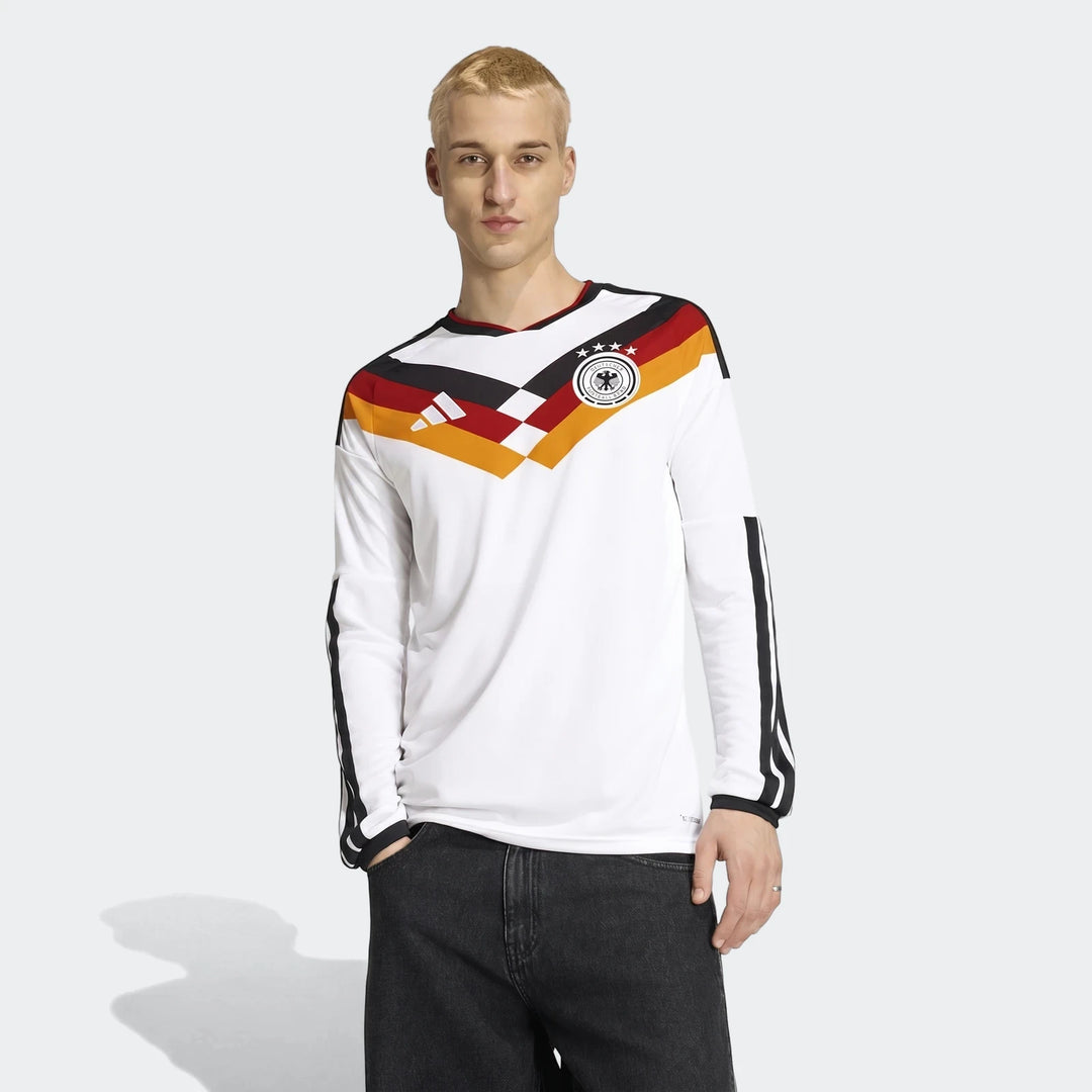 White Germany 25/26 Long Sleeve Home Jersey worn by a male model, featuring team crest and adidas logo.