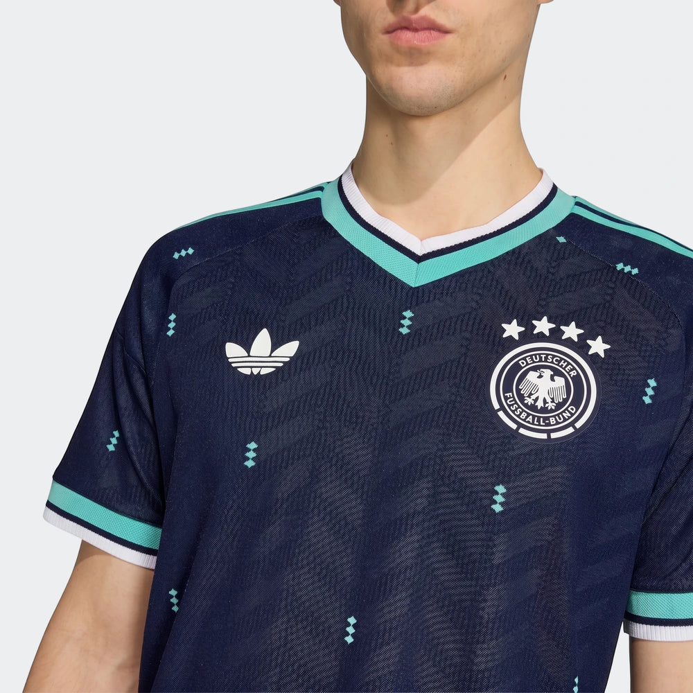 Germany 26 Away Authentic Jersey in dark blue, featuring the national team crest and Adidas logo, worn by a model in a