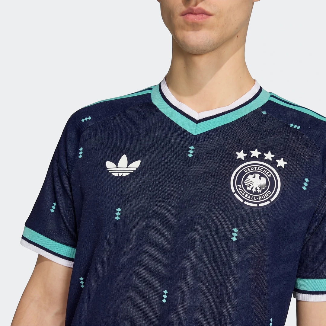 Germany 26 Away Authentic Jersey in dark blue, featuring the national team crest and Adidas logo, worn by a model in a