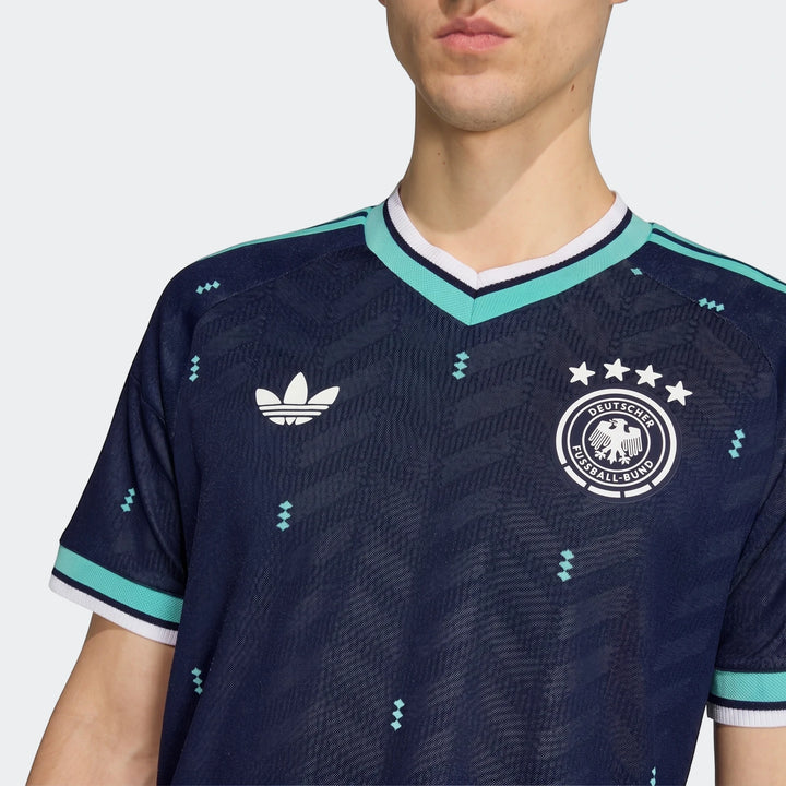 Germany 26 Away Authentic Jersey in dark blue, featuring the national team crest and Adidas logo, worn by a model in a