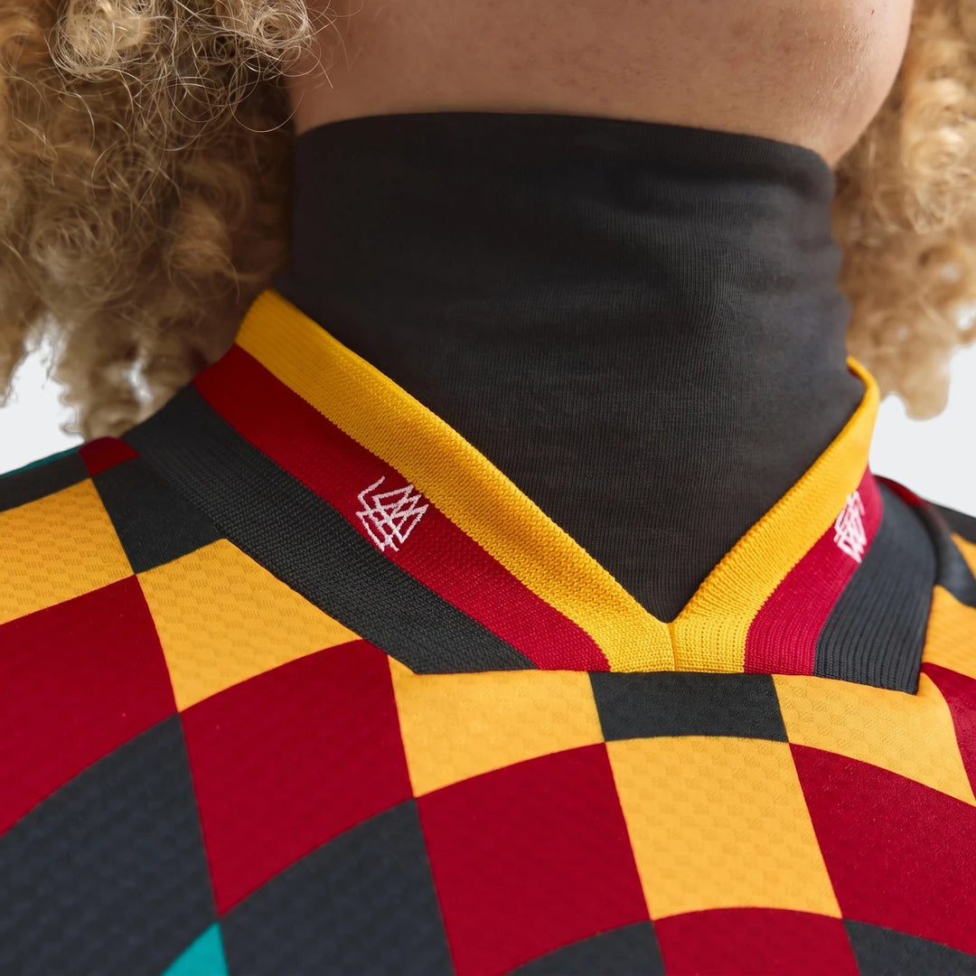 Close-up of the Germany Away Jersey 1994, featuring its distinctive dark grey, red, and yellow checkerboard pattern V-neck