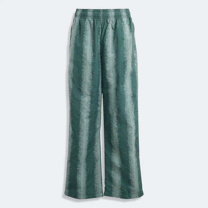 Green patterned adidas Sst Loose Track Pants with an elastic waistband and subtle logo, displayed flat, featuring vertical