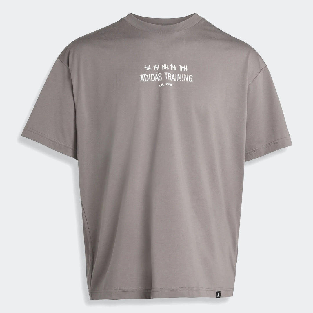 Grey Adidas Primelift Graphic T-Shirt with white logo print on the front, short sleeves, and a crew neck.