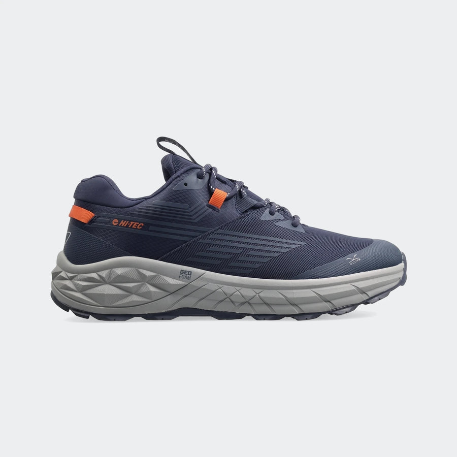 Dark blue Hi-Tec Fuse Trail Low II sneakers for men, featuring orange accents and a textured grey sole, shown from a side