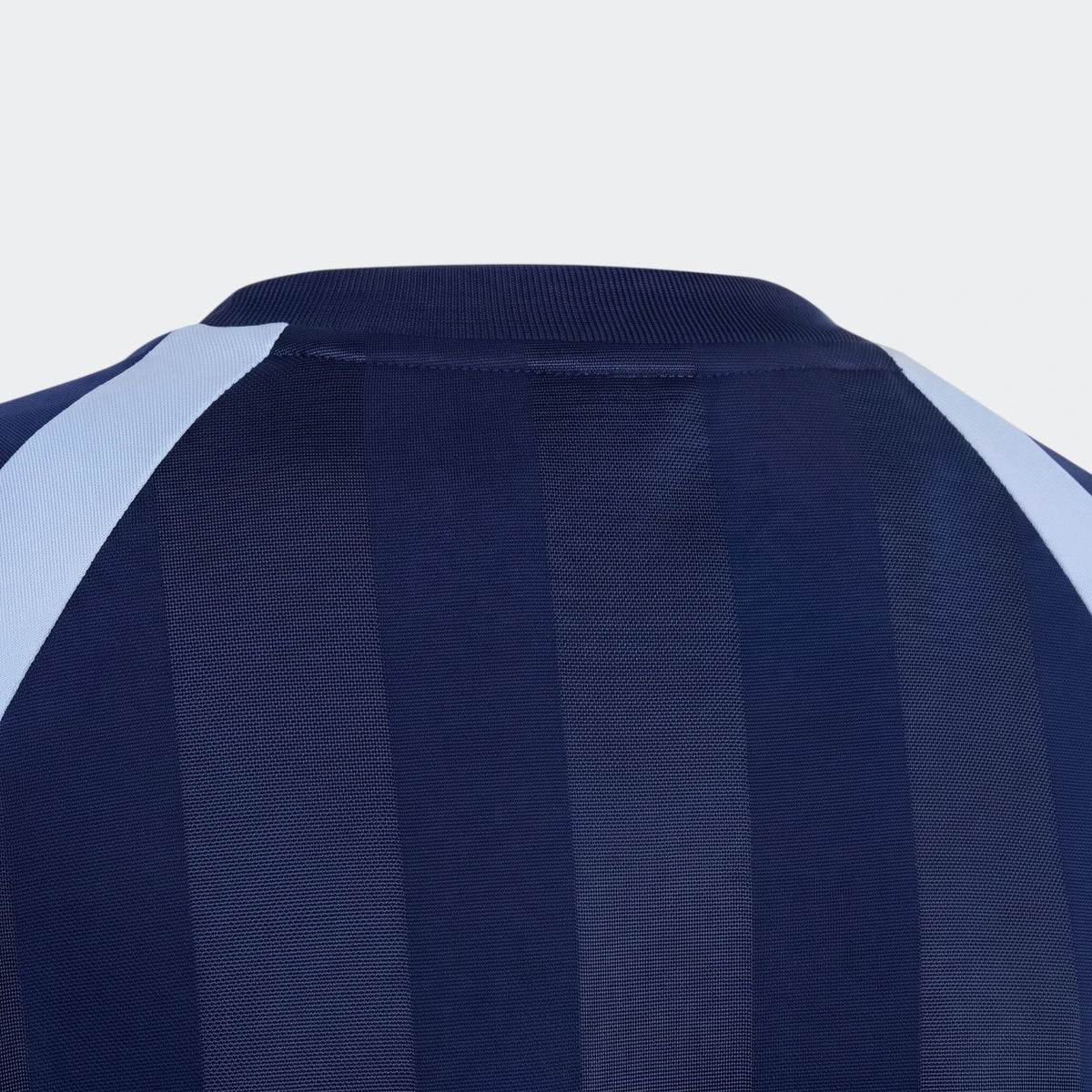 Close-up back view of a House Of Tiro Unisex T-Shirt in navy blue with light blue shoulder panels and stripes.
