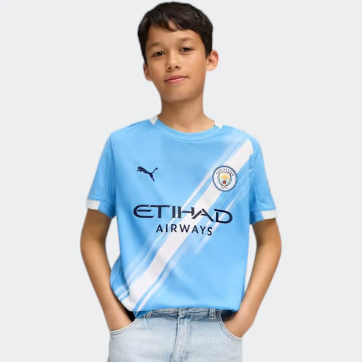 Mcfc Y Hm Jsy 25/26 Blue Jersey