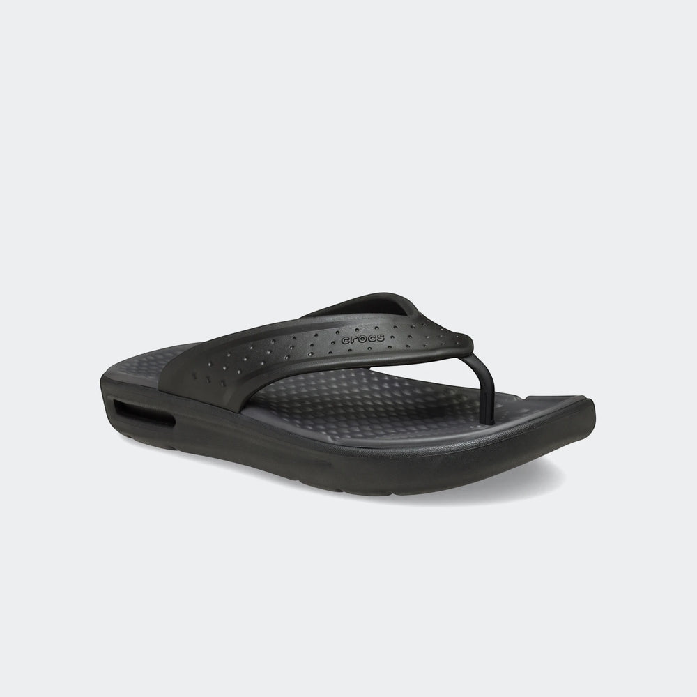 Single black Crocs In Motion Lite Ride flip-flop with a textured footbed and perforated strap, displayed at an angle.