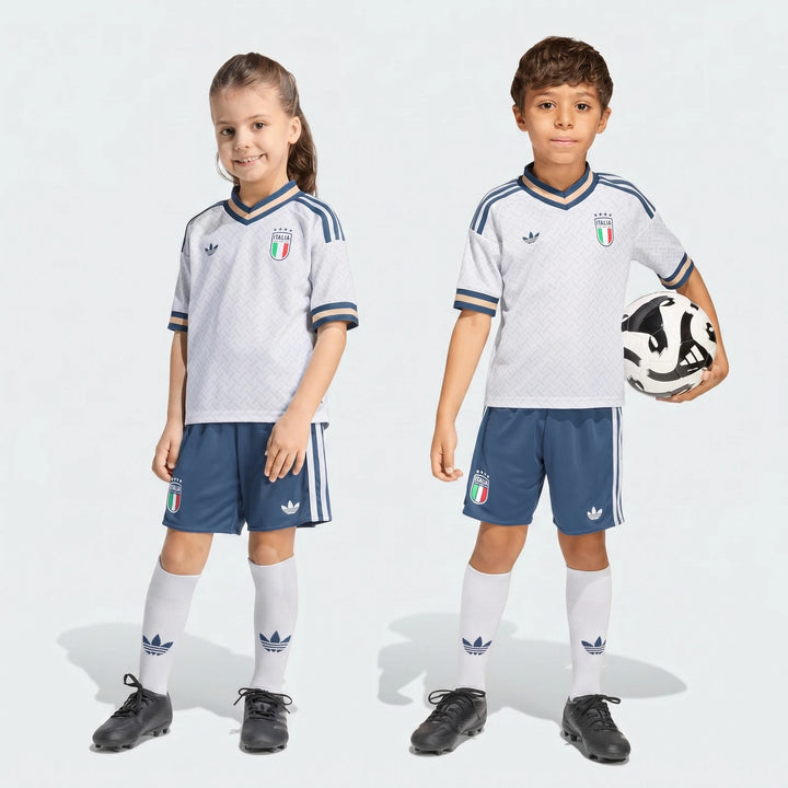 Italy 25/26 Away Mini Kit for kids, featuring a white jersey, blue shorts, white socks, and a soccer ball, full body studio