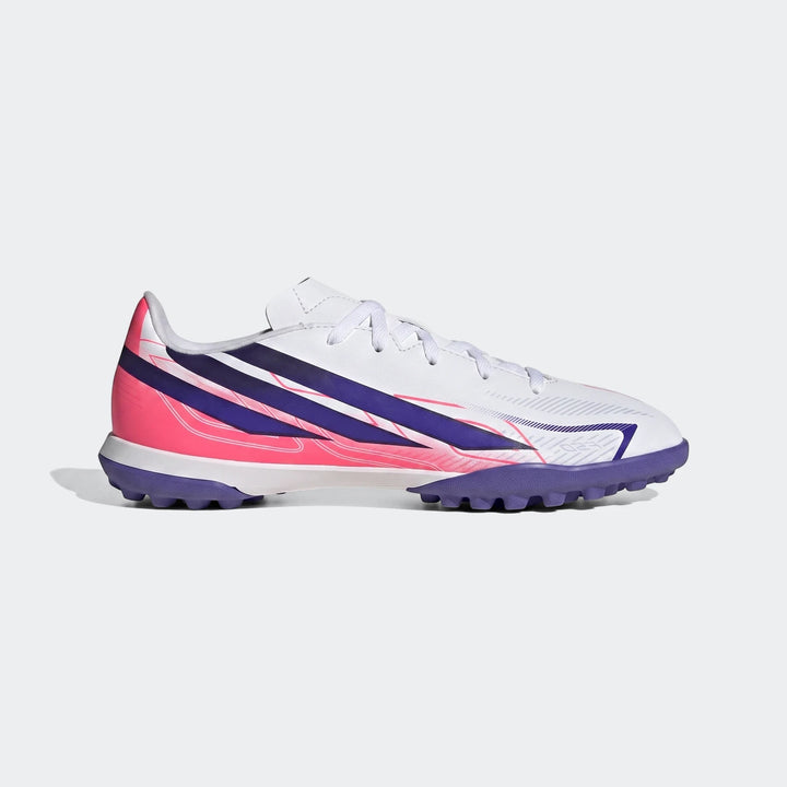 Kids' Adidas F50 Hyperfast Club Turf football boot, featuring a white upper with vibrant pink and purple stripes, showcased