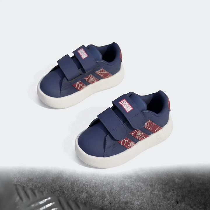 Pair of navy blue and white Kids Grand Court Spider-Man Cloudfoam sneakers with velcro straps and spiderweb pattern on a